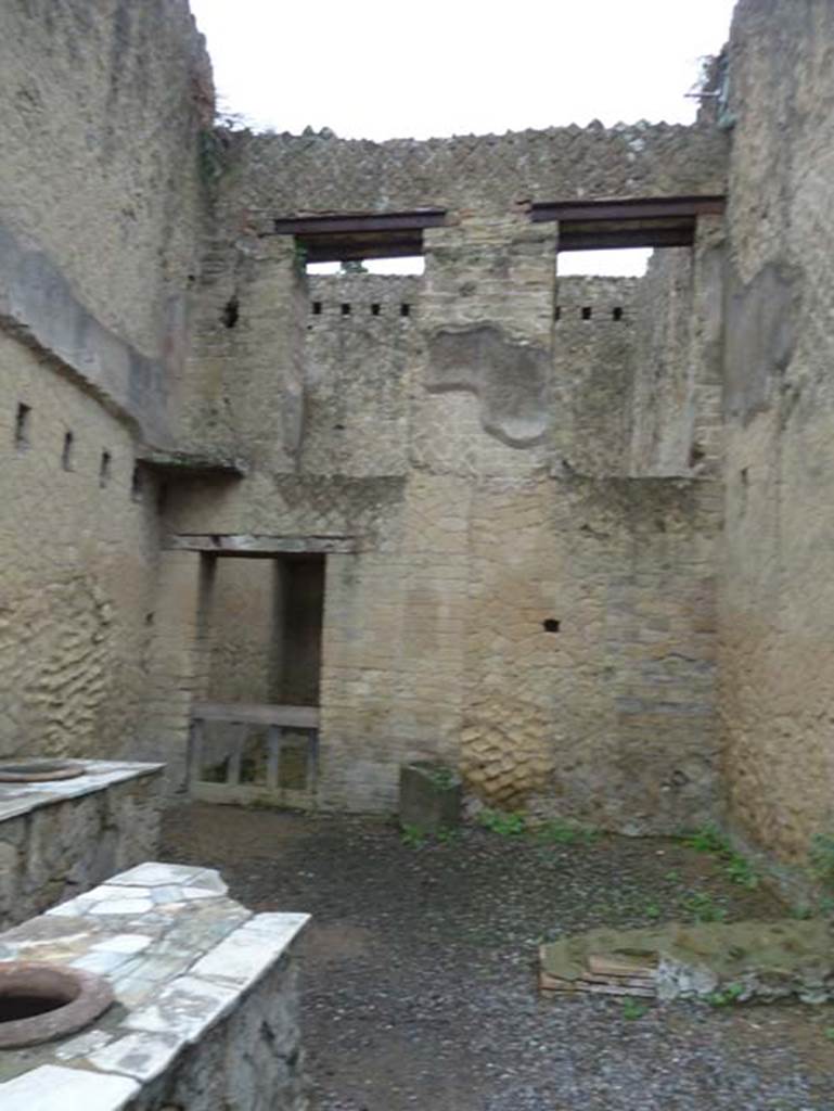 Ins. Orientalis II.6, Herculaneum. September 2015.
Looking towards east wall of shop/bar-room with doorways on the upper floor, as well as doorway to a rear room from the shop/bar-room.